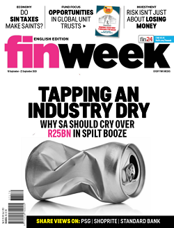 Magazine cover with crushed silver tin can on big bold text in pink and black