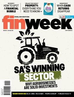 Magazine cover with a farm tractor with orange and black bold writing 